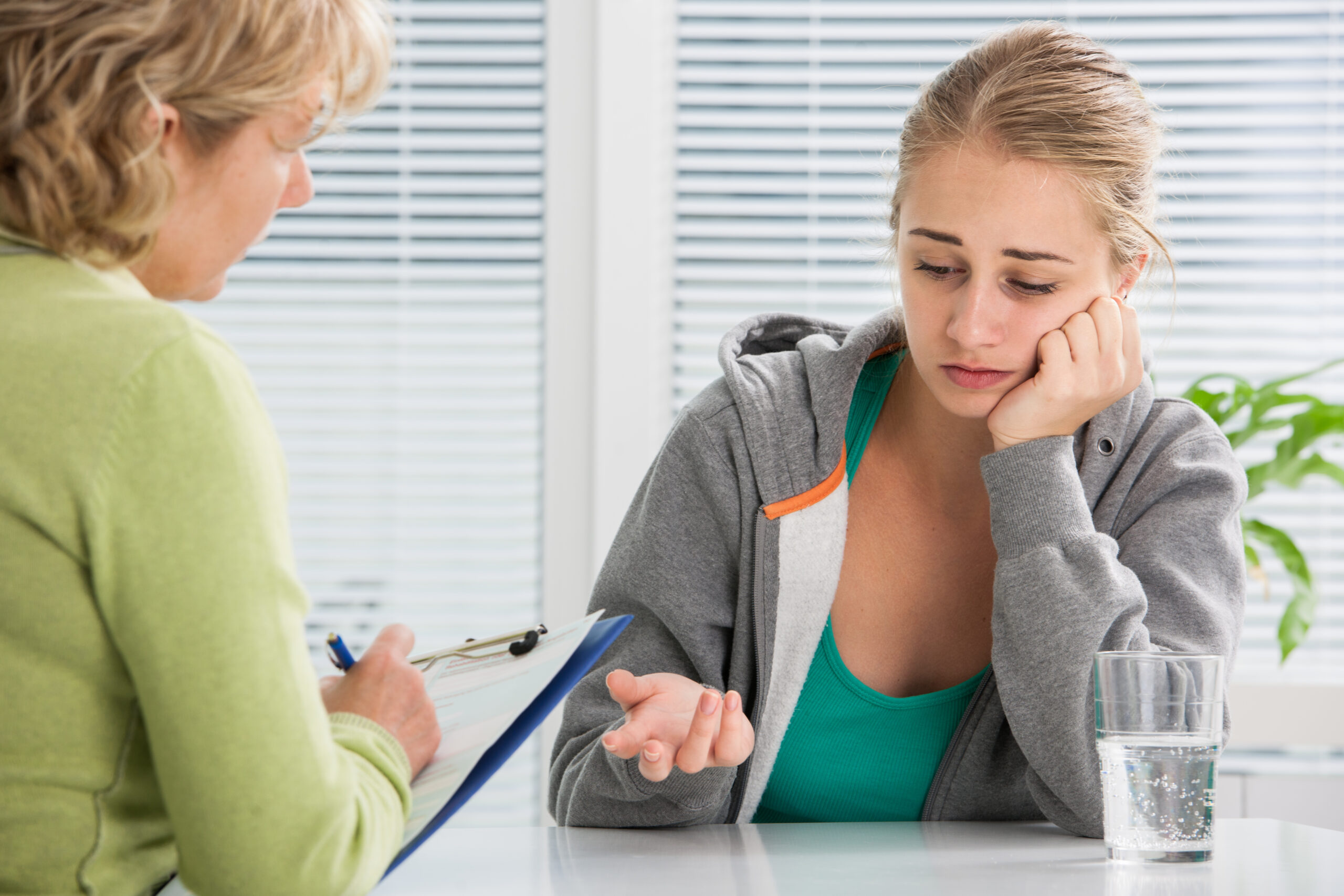 Client having a supportive conversation with a psychologist during a therapy session